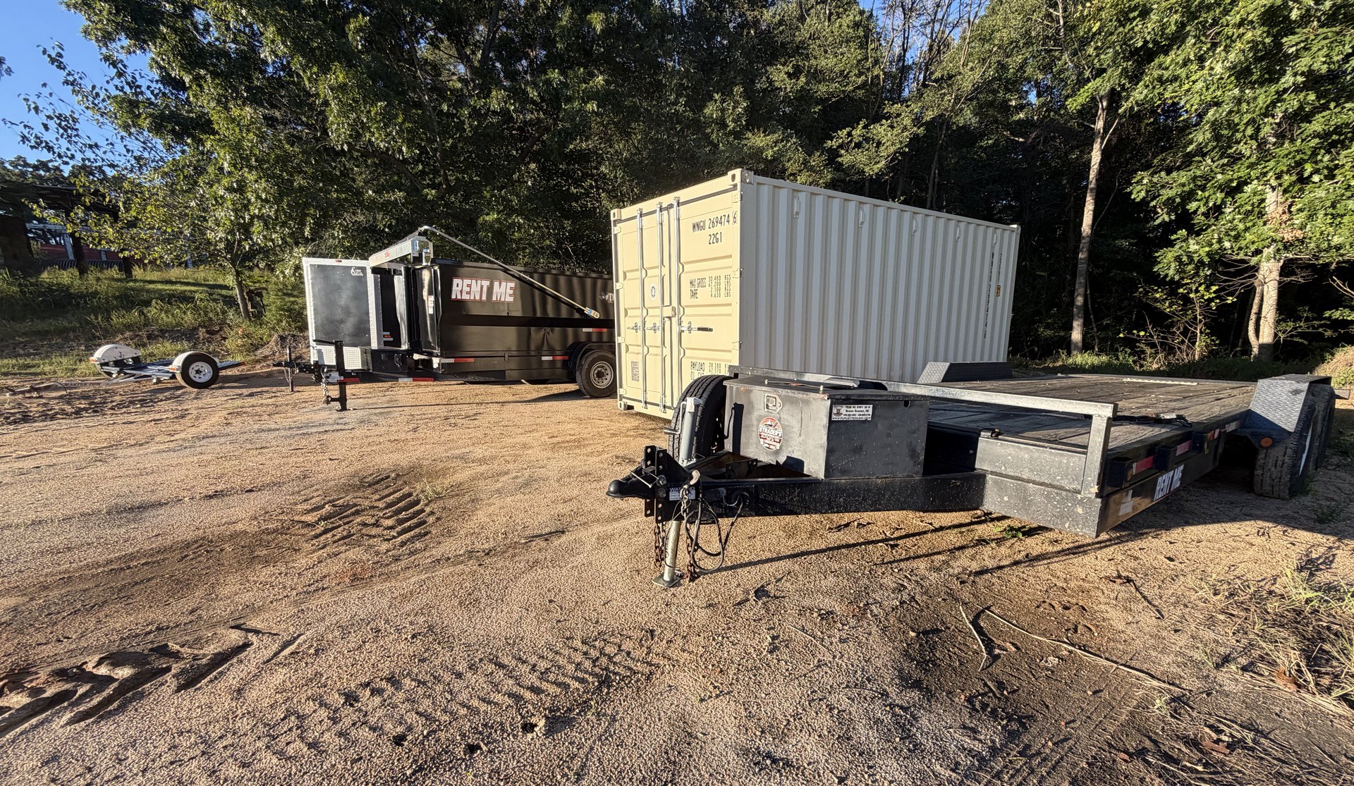 Gooseneck trailer loaded with a side-by-side and golf cart, hitched and ready to roll