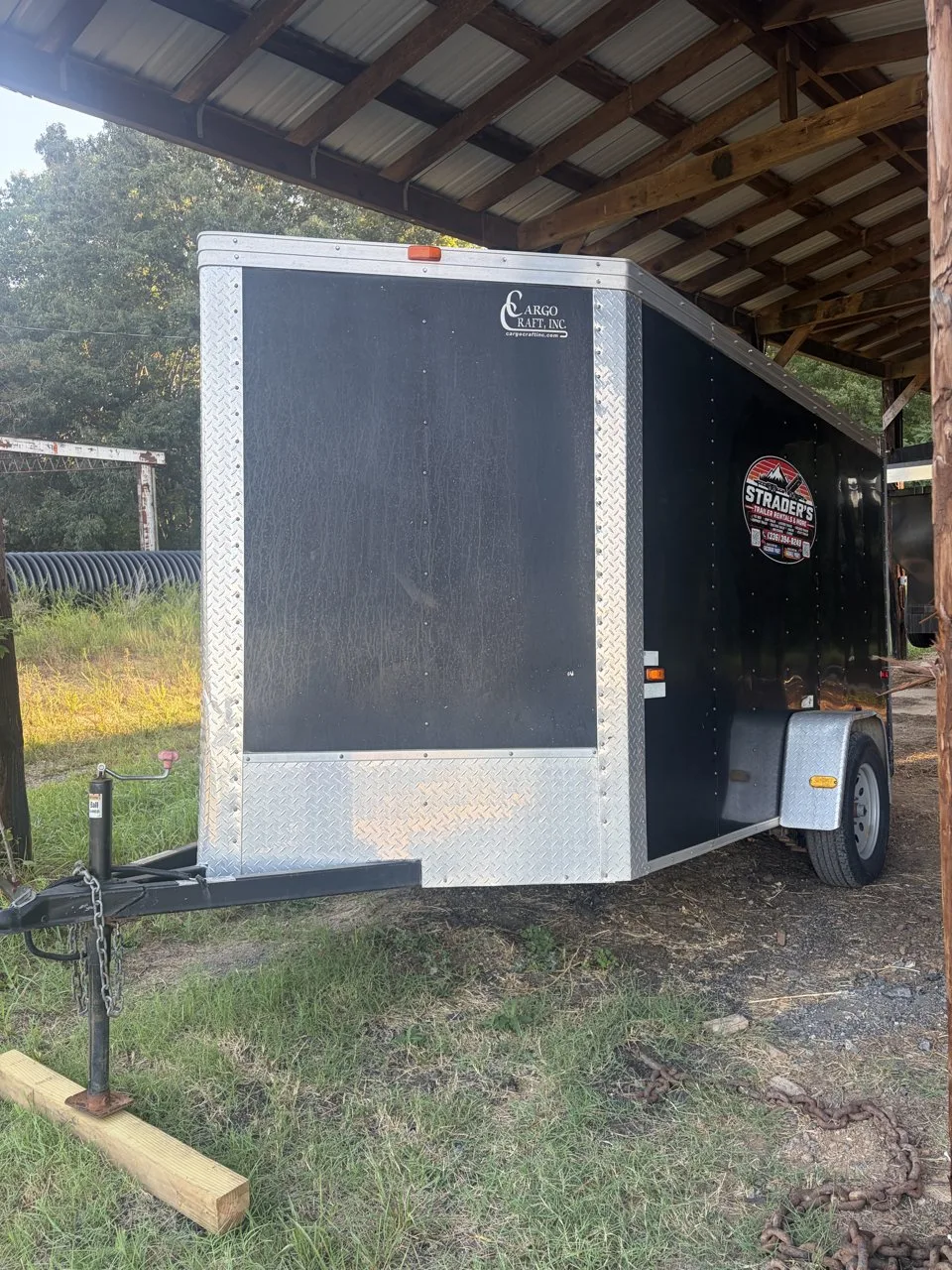 Black 6x12 enclosed cargo trailer with diamond plate trim